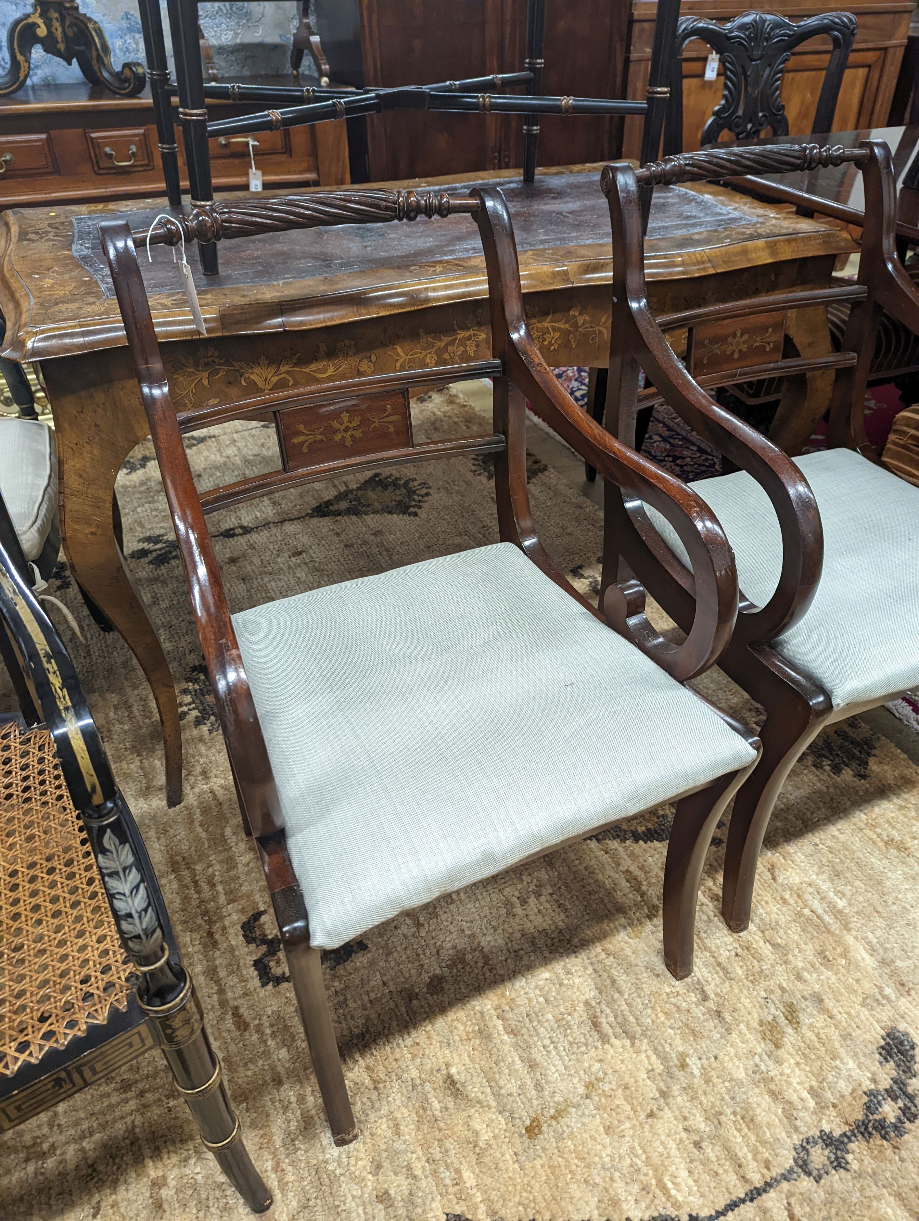 A pair of Regency style brass inlaid mahogany elbow chairs, width 48cm, depth 48cm, height 88cm